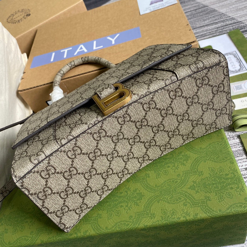 Side profile of structured classic women's handbag – women's luxury accessory