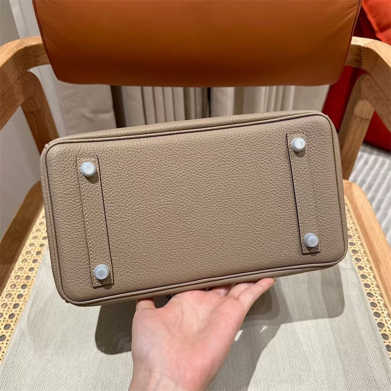 Side view of graceful structured handbag