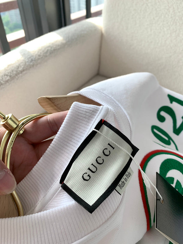 Side profile of Gucci luxury clothing with monogram-inspired silhouette