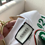 Side profile of Gucci luxury clothing with monogram-inspired silhouette