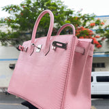 Side view of considered structured handbag