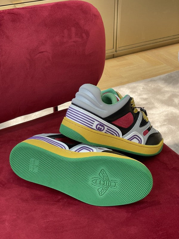 Side profile of Gucci two-tone sneakers signature lace-up style