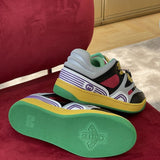 Side profile of Gucci two-tone sneakers signature lace-up style