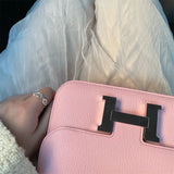 Side view of considered structured handbag