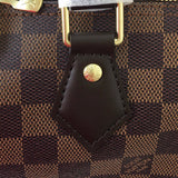 Side profile of premium statement women's handbag – women's luxury accessory