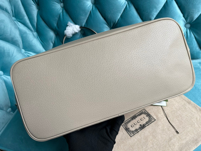 Styled lifestyle shot of modern signature women's handbag – women's designer-style accessory