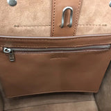 Styled lifestyle shot of modern signature women's handbag – women's designer-style accessory