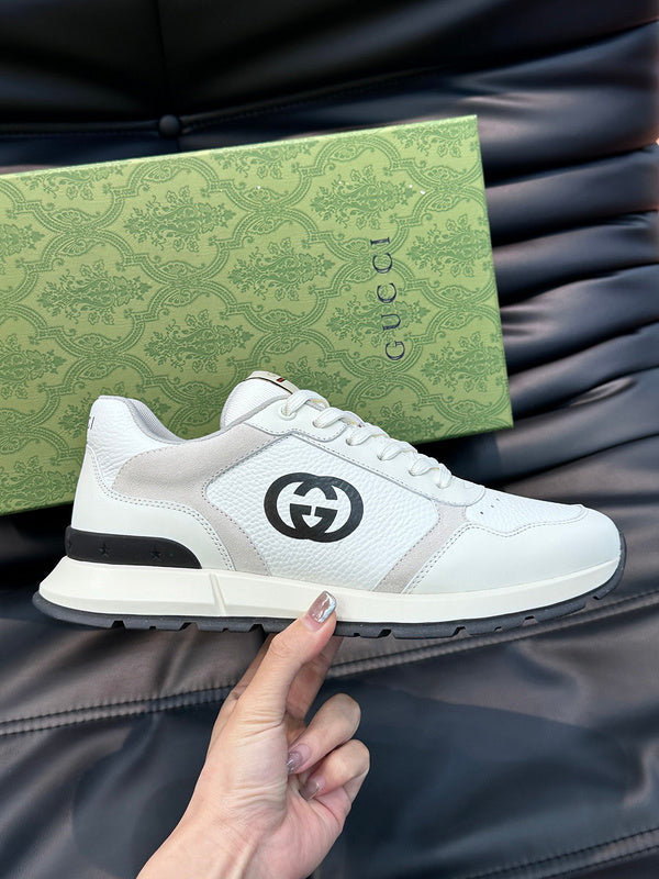Gucci Designer sneakers in muted earth tones heritage-inspired look front view