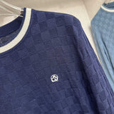 Full styled look of Louis Vuitton luxury clothing with signature branding