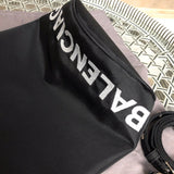 Back view of classic polished women's handbag – women's luxury accessory