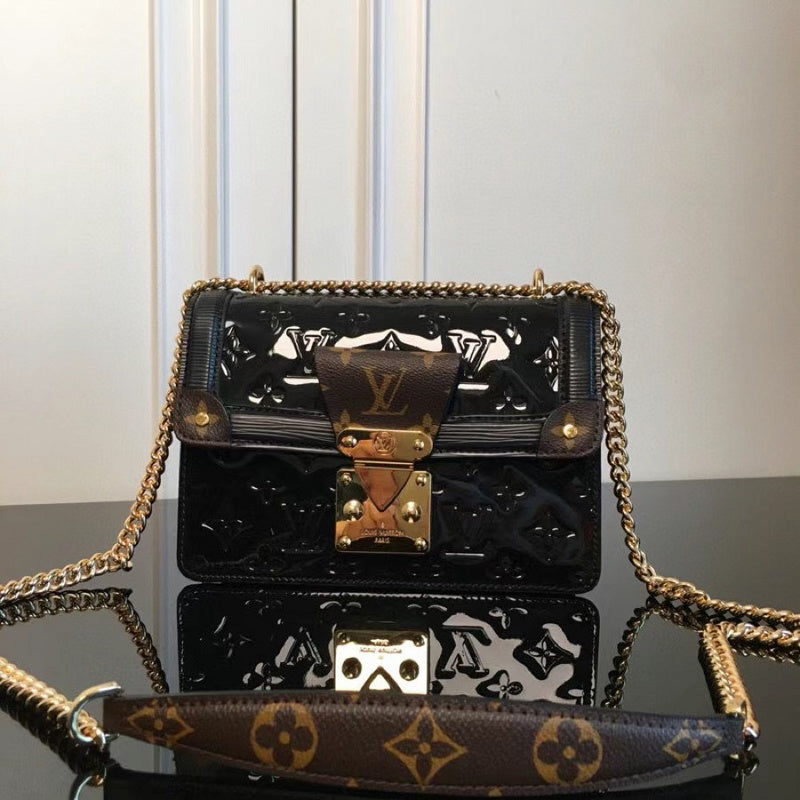 Front view of elevated refined women's handbag – women's luxury accessory