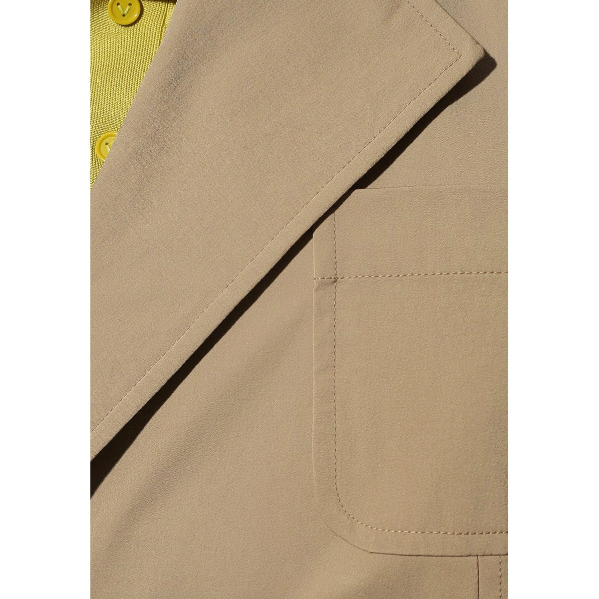 Close-up of Bottega Veneta jackets hardware and fine stitching