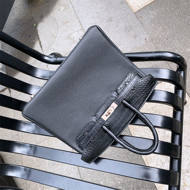 Side view of considered structured handbag