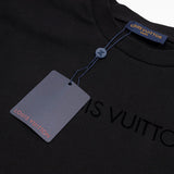 Flat lay presentation of Louis Vuitton cotton t-shirt with monogram-inspired silhouette