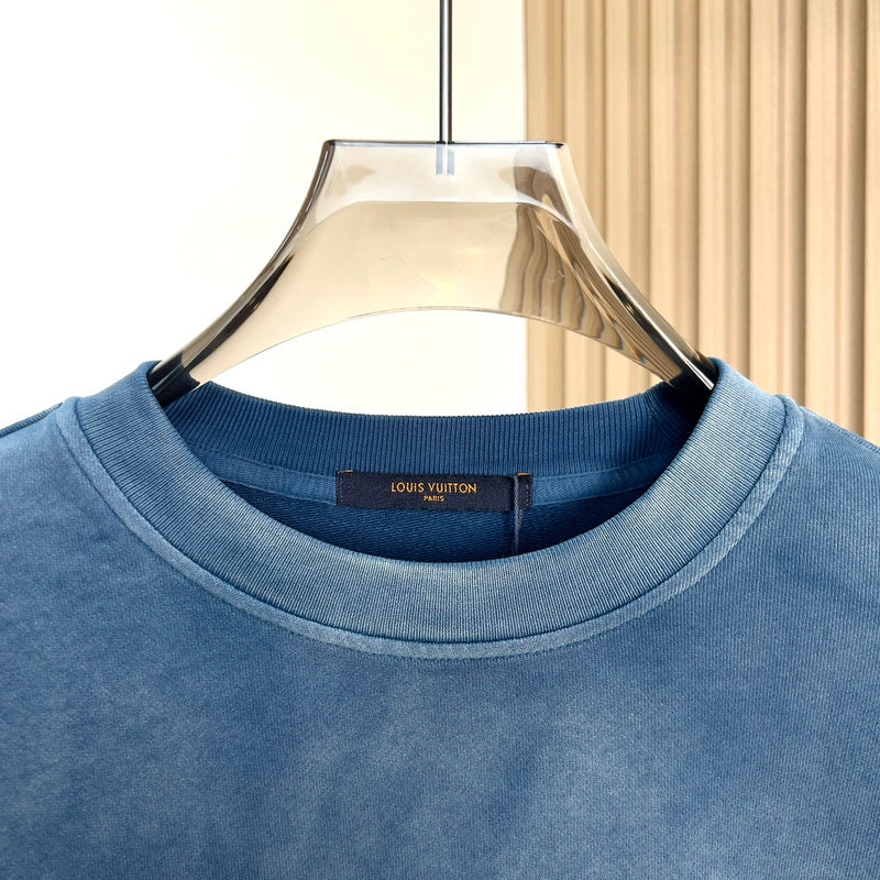 Flat lay presentation of Louis Vuitton luxury clothing with everyday silhouette
