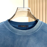 Flat lay presentation of Louis Vuitton luxury clothing with everyday silhouette