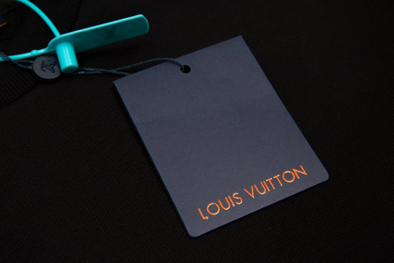 Flat lay presentation of Louis Vuitton luxury clothing with monogram-inspired silhouette