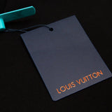 Flat lay presentation of Louis Vuitton luxury clothing with monogram-inspired silhouette