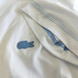 Side profile of Lacoste luxury clothing with tailored silhouette