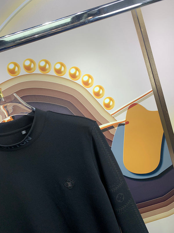 Full styled look of Louis Vuitton luxury clothing with monogram-inspired silhouette