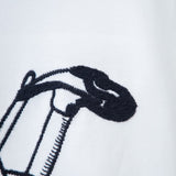 Flat lay presentation of Louis Vuitton luxury clothing with logo-detail design