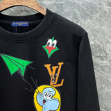 Flat lay presentation of Louis Vuitton luxury clothing with signature branding