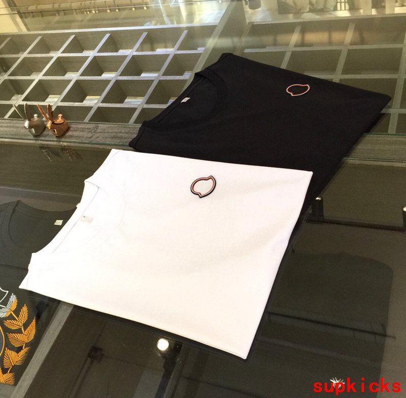 Flat lay presentation of Moncler luxury clothing with contemporary cut