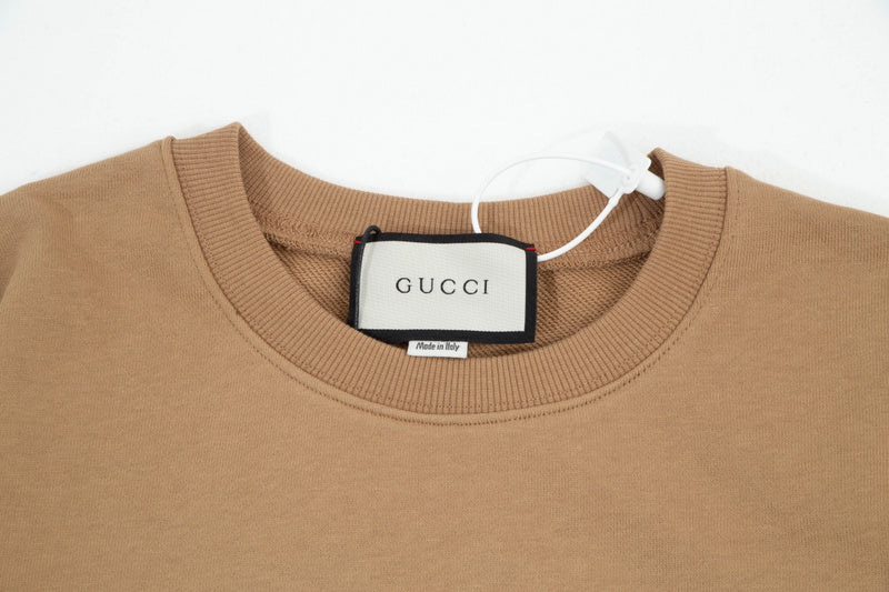Close-up detail shot of Gucci luxury clothing with contemporary cut