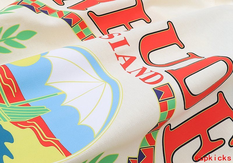Close-up detail shot of Rhude luxury clothing with signature branding