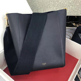 Side profile of modern structured women's handbag – women's luxury handbag