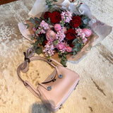 Side view of contemporary structured handbag