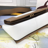Handle and strap detail of everyday-luxe signature women's handbag – women's designer-style accessory