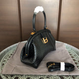 Side profile of modern chic women's handbag – women's designer-style accessory