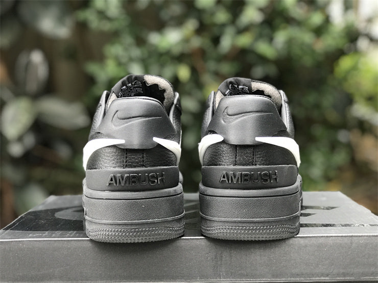 Side profile of Nike fresh white-and-black sneakers signature lace-up style