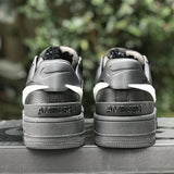 Side profile of Nike fresh white-and-black sneakers signature lace-up style