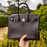 Side view of considered structured handbag