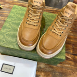 Side profile of Gucci crisp white sneakers retro runner design