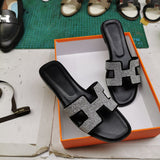 Hermes sandals Style 140 - close-up of statement logo accent
