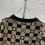 Flat lay presentation of Louis Vuitton luxury clothing with contemporary cut