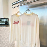 Flat lay presentation of Louis Vuitton luxury clothing with monogram-inspired silhouette