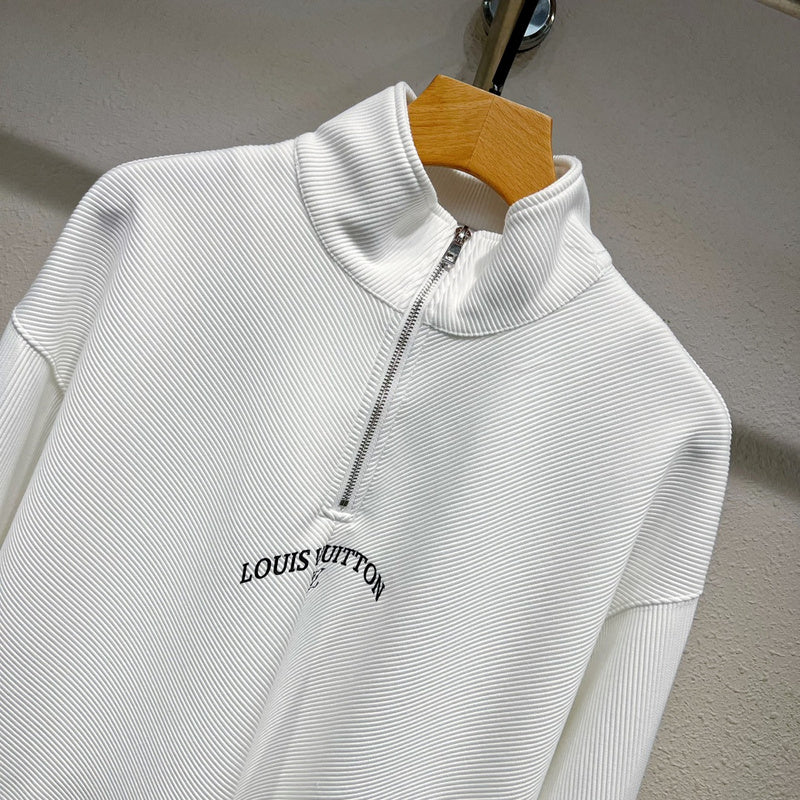 Close-up detail shot of Louis Vuitton luxury clothing with monogram-inspired silhouette