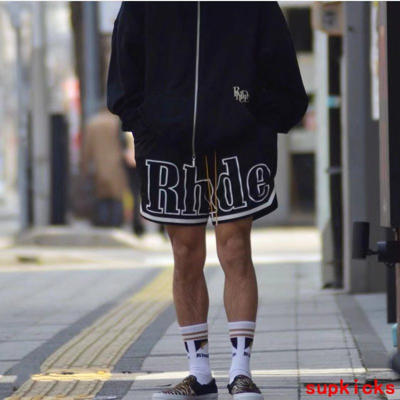Side profile of Rhude luxury clothing with monogram-inspired silhouette