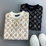 Close-up detail shot of Louis Vuitton luxury clothing with monogram-inspired silhouette