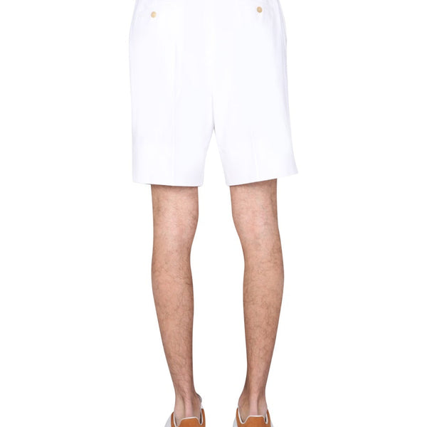 Close-up of Alexander McQueen pants hardware and fine stitching