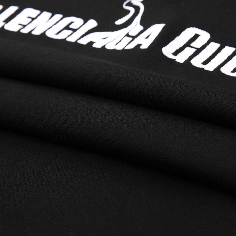 Close-up detail shot of Gucci luxury clothing with signature branding