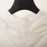Side profile of Louis Vuitton luxury clothing with logo-detail design