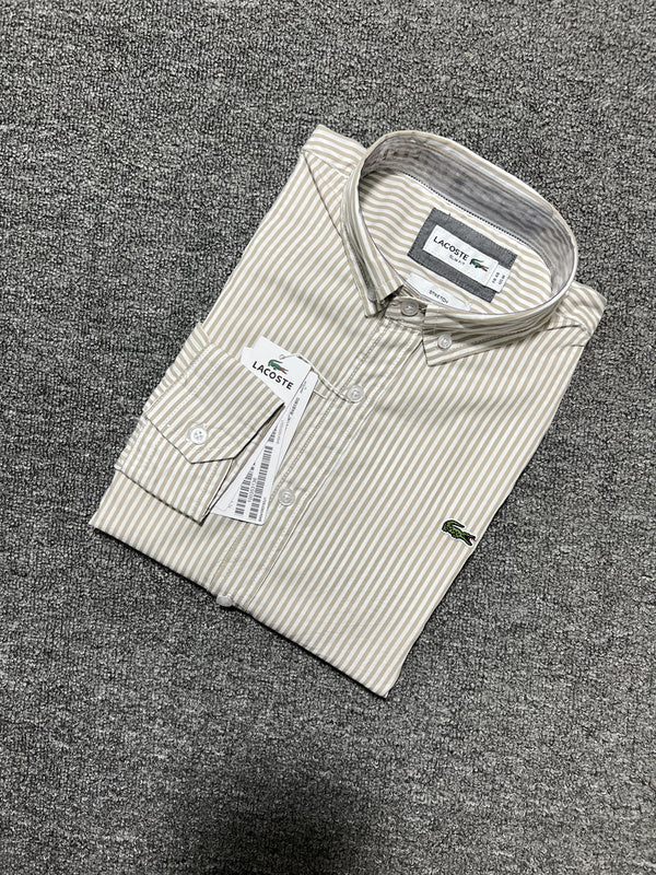 Flat lay presentation of Lacoste luxury clothing with monogram-inspired silhouette