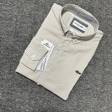 Flat lay presentation of Lacoste luxury clothing with monogram-inspired silhouette