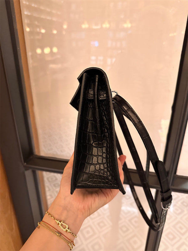 Side view of sleek structured handbag