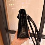 Side view of sleek structured handbag